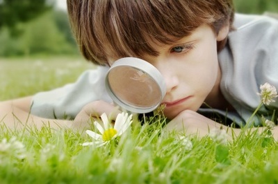 Boy with magnifying glass